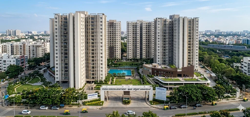 Exterior architectural view of Purva Horizon apartments featuring modern facade design and landscaped surroundings.